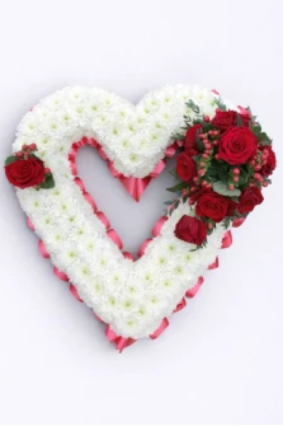 Based Open Heart - At Sarah Coxon Floral Design we are delighted to present this product available for flower delivery in Mid and North Norfolk. 

A based open heart is a traditional funeral tribute, it is based in white Chrysanthemums, and is edged in hand pleated ribbon in a colour co-ordinating waterproof ribbon. The spray of flowers on top of the heart is raised above the Chrysanthemums and includes a beautiful selection of Roses, spray Carnations and other flowers to complement the design. 

The flowers are arranged in water retaining foam (oasis) to ensure maximum freshness. 

Standard - approx size 17"

Deluxe - approx size 19"

Luxury - approx size 19" - larger sprays than the deluxe size

We deliver directly to all of the local funeral directors and will contact them to confirm a delivery time. 

Our flowers at Sarah Coxon Floral Design arrive fresh from the Dutch auctions every day so you can be rest assured we are using the best quality of flowers available. 

If you would like to choose a colour scheme, please state this in the special request box. Suggested colour schemes are red and white, yellow and white, pink and white and peach and white. If no colours have been selected we will use the same colours as the picture.