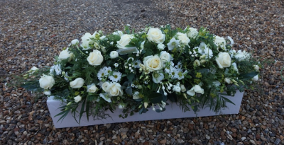 Elegant Spray - This is a beautiful and elegant natural looking spray which is designed to rest on top of a casket. It contains a variety of mixed flowers in the neutral colour scheme of creams, whites and lime green.

 

This stunning spray includes Stephanotis (when in season), Roses, Lisianthus and single flowered Chrysanthemums together with other seasonal flowers which enhance and complement the style of this elegant floral tribute.

 

The Elegant Spray has been arranged in water retaining foam (oasis) to ensure maximum freshness and is available in 3 sizes.

 

Standard size is 4ft

 

Deluxe size is 5ft

 

Luxury size will be the full length

 

 

 

We deliver directly to all of the local funeral directors and will contact them to confirm a delivery time and to ensure we make the correct size if a full sized spray is ordered.

 

Our flowers at Sarah Coxon Floral Design arrive fresh from the Dutch auctions every day so you can be rest assured we are using the best quality of flowers available.

 

At Sarah Coxon Floral Design we are delighted to present this product available for flower delivery in Mid and North Norfolk.