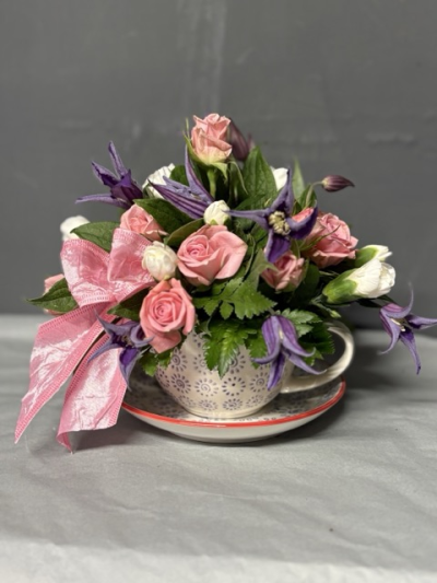 Pretty Teacup - Fancy a cup of tea??

This stunning arrangement is designed in a ceramic cup and saucer. The flowers have been carefully chosen to complement each other and to create this beautiful floral display. The pinks and purple are a vibrant colour combination designed to look great in any room of the home.

The fresh cut flowers are arranged in a water retaining foam (oasis) which holds the flowers firmly whilst providing a vital water supply to keep the flowers fresh.

Arrangements are a very popular choice due to their ease of care, they are ideal for someone who appreciates nicely arranged flowers but who may be too busy to arrange the flowers themselves.

These beautiful blooms are delivered daily fresh from the Dutch auctions, so you can be rest assured you will be sending the best quality of flowers there is.

Please note it may be necessary to substitute some varieties of the flowers due to seasonal availability. If we do this the overall design will still be as stunning as the picture.

 The product shown in the picture is the deluxe size