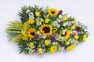 Country Sheaf Spray - This is a sheaf spray, which, although it gives the appearance of a tied bunch of flowers, it is arranged in water retaining foam (oasis) to ensure maximum freshness.

 

This pretty sheaf spray includes Sunflowers, Roses, Lisianthus and Stocks together with other seasonal Cottage garden style flowers and foliages which complement the style of this beautiful floral tribute. It is finished with an organza bow wrapped around the stems.

 

The Country Sheaf Spray is available in 3 sizes.

 

Standard size is 2ft

 

Deluxe size is 2 ½ ft

 

Luxury size is 3ft

 

 

 

If you would like an alternative colour scheme, please indicate this in the request box when you order.

 

 

 

We deliver directly to all of the local funeral directors and will contact them to confirm a delivery time and to ensure we make the correct size if a full sized spray is ordered.

 

Our flowers at Sarah Coxon Floral Design arrive fresh from the Dutch auctions every day so you can be rest assured we are using the best quality of flowers available.

 

At Sarah Coxon Floral Design we are delighted to present this product available for flower delivery in Mid and North Norfolk.