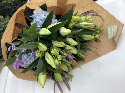 Seasonal Choice flowers - This seasonal bouquet will contain only the best choice the season has to offer, so whether it be spring, summer, autumn or winter, you can be confident these will surely be a wonderful surprise!

The selection of blooms will be luxury flowers and will not contain Carnations or Chrysanthemums (unless you specifically request them in the special request box).

Please note the choice of flowers and foliage will always be unique due to seasonal availabilty and therefore will not necessrily be the same as shown in the picture, however if you would like to select a colour scheme, please ensure you add this to the special request box.

This bouquet of beautiful flowers is a part of our ECO range as they are wrapped in natural kraft paper with a raffia bow. all biodegradable together with your personal card message, this is the complete package which will sure to be admired by all!

These beautiful blooms are delivered daily fresh from the Dutch auctions, so you can be rest assured you will be sending the best quality of flowers there is.

The product shown in the picture is the deluxe sized bouquet.