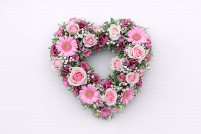 Mixed Open Heart - A mixed open heart is a modern twist on a traditional funeral tribute. It is full of mixed flowers, which includes Roses, Spray Carnations and other flowers which have been thoughtfully selected to complement the design. It is edged in hand pleated ribbon in a colour co-ordinating waterproof ribbon. 

The flowers are arranged in water retaining foam (oasis) to ensure maximum freshness. 

Standard - approx size 17”

Deluxe - approx size 19”

We deliver directly to all of the local funeral directors and will contact them to confirm a delivery time.
